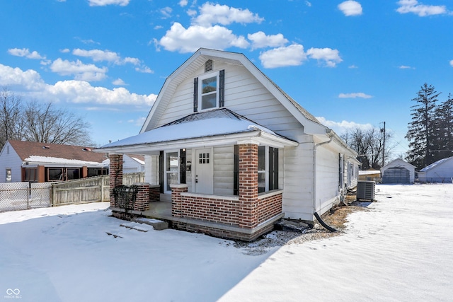 bungalow-style house with cooling unit and covered porch