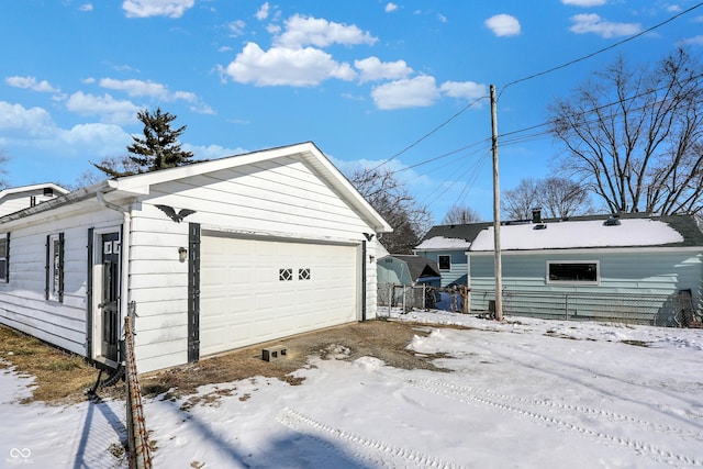 view of snow covered garage