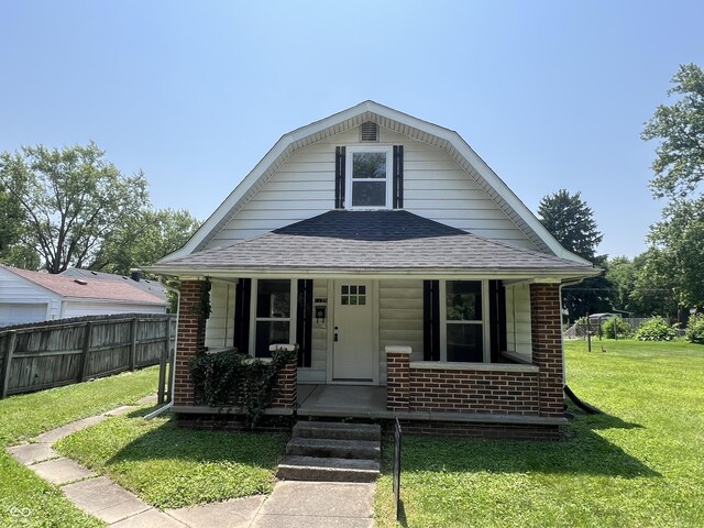 1175 Central Ave, Noblesville, IN 46060 - view of front of house featuring roof with shingles, covered porch, and brick siding