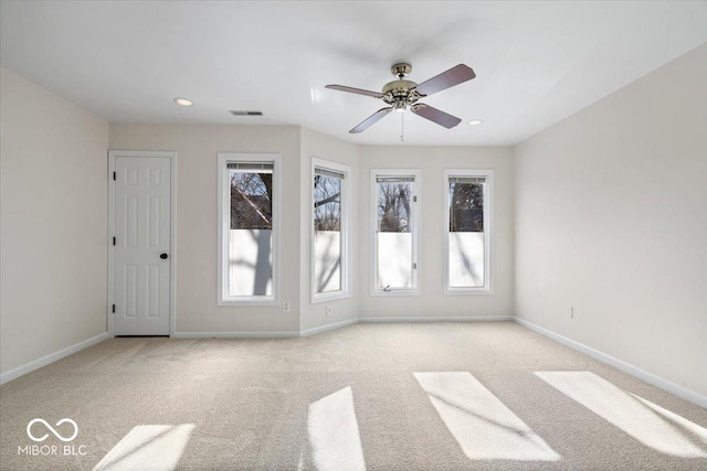 carpeted empty room with ceiling fan