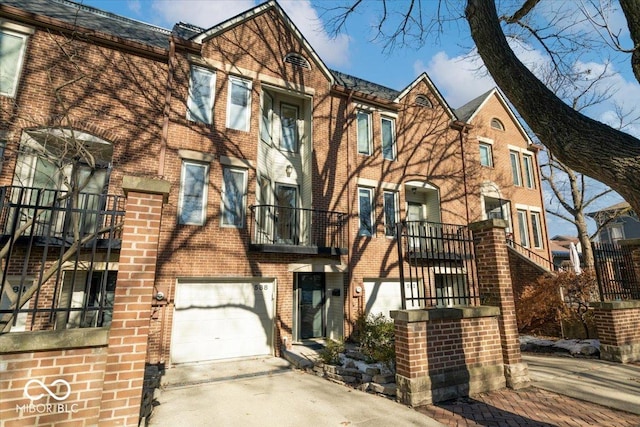 tudor-style house featuring a garage