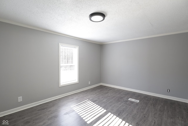 unfurnished room featuring ornamental molding, dark hardwood / wood-style floors, and a textured ceiling