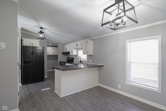 kitchen featuring pendant lighting, white cabinetry, stainless steel electric range oven, black fridge with ice dispenser, and kitchen peninsula