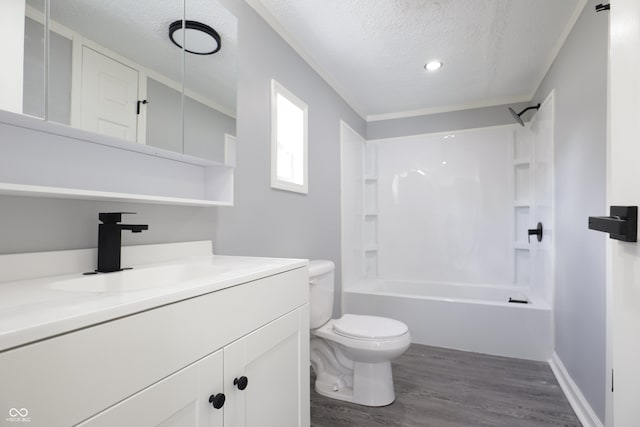 full bathroom featuring toilet, bathtub / shower combination, wood-type flooring, a textured ceiling, and vanity