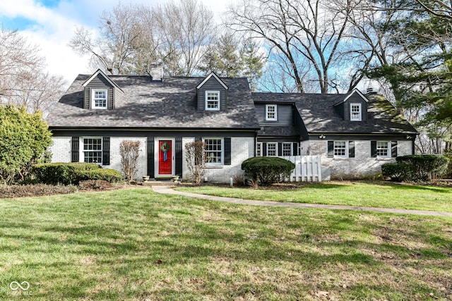 cape cod-style house with a front lawn