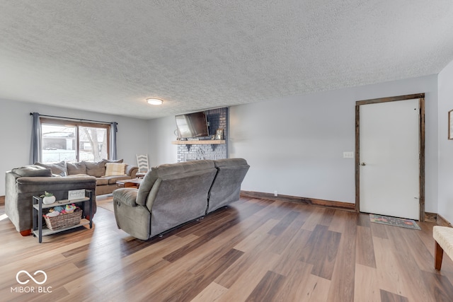 living room featuring hardwood / wood-style floors and a textured ceiling