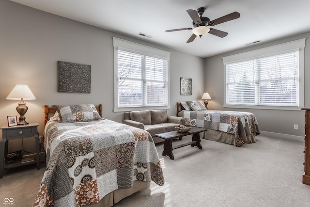 bedroom with light carpet and ceiling fan