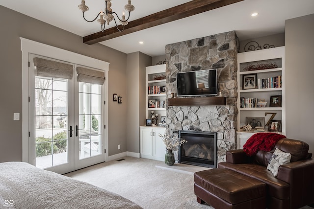 interior space with beamed ceiling, light carpet, a wealth of natural light, and french doors