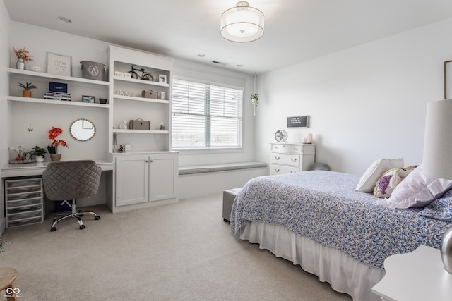 bedroom featuring light colored carpet