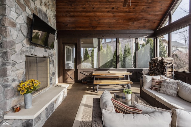 sunroom with lofted ceiling and wooden ceiling