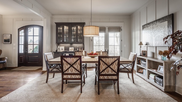 dining space with french doors and dark hardwood / wood-style floors