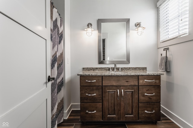 bathroom featuring hardwood / wood-style flooring and vanity