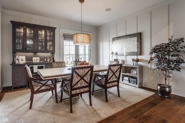 dining space featuring wood-type flooring