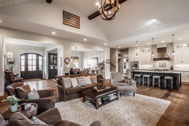 living room with an inviting chandelier, high vaulted ceiling, wooden ceiling, dark hardwood / wood-style flooring, and beamed ceiling