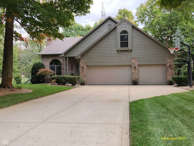 view of front of property featuring a garage and a front yard