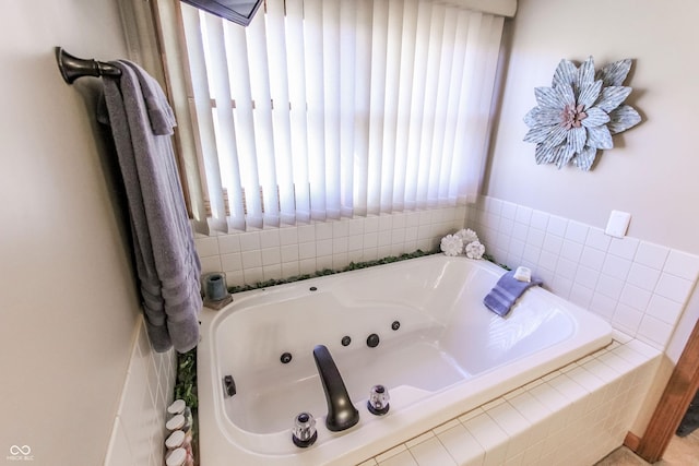 bathroom featuring tiled tub