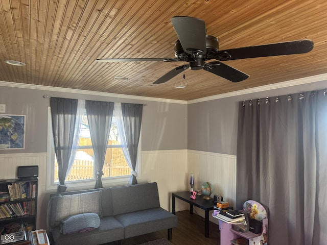 living area with wood ceiling, ornamental molding, ceiling fan, and hardwood / wood-style flooring