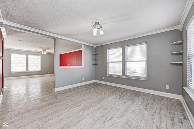 empty room featuring crown molding, ceiling fan, a textured ceiling, and light hardwood / wood-style floors