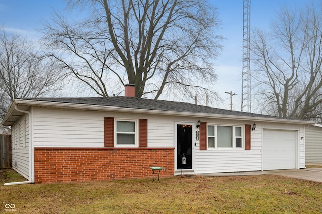 view of front of house featuring a garage and a front lawn