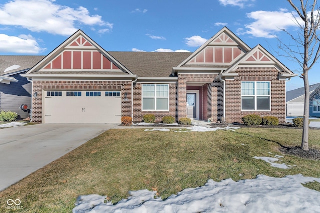 view of front of house featuring a garage and a front lawn