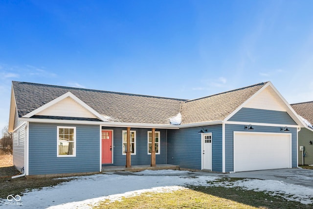 single story home with a garage and a yard