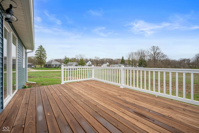 wooden deck with a yard