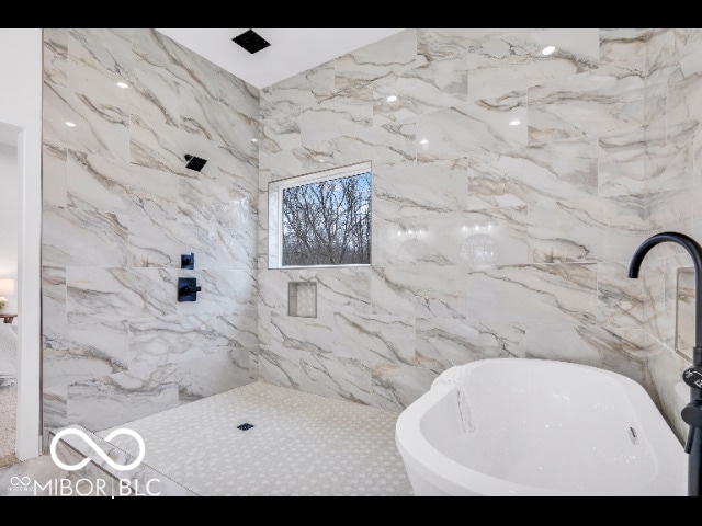 bathroom featuring a tub and sink