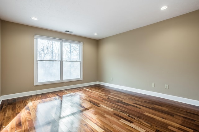 unfurnished room featuring hardwood / wood-style floors