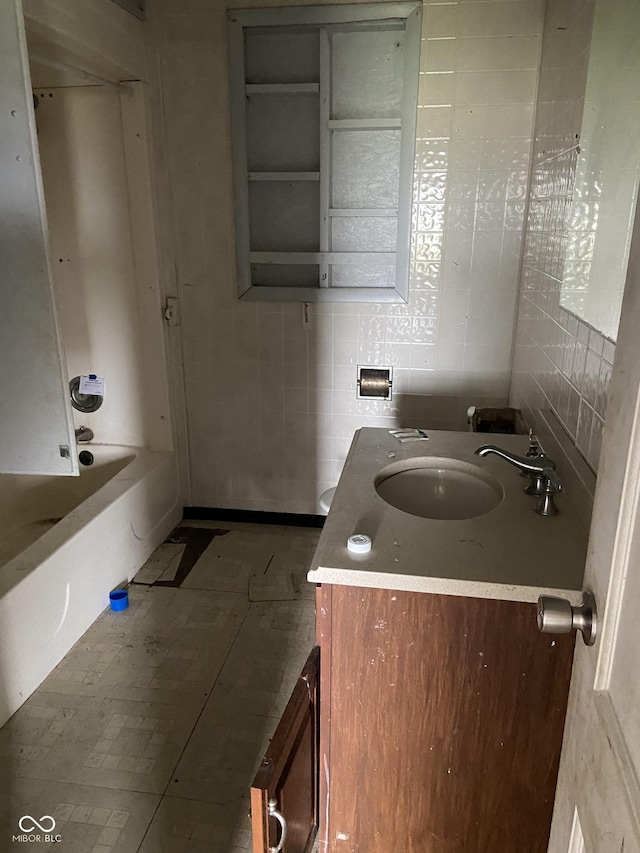 bathroom featuring vanity and bathing tub / shower combination