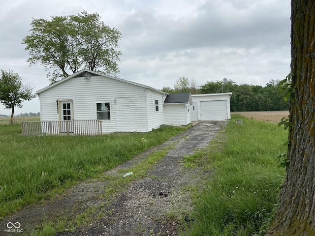 view of side of property with a garage