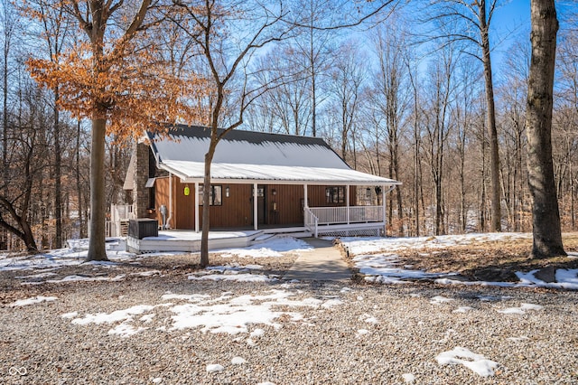 view of front of house with cooling unit and covered porch