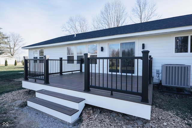 back of house featuring a deck and central air condition unit