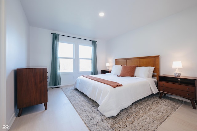 bedroom with light hardwood / wood-style floors