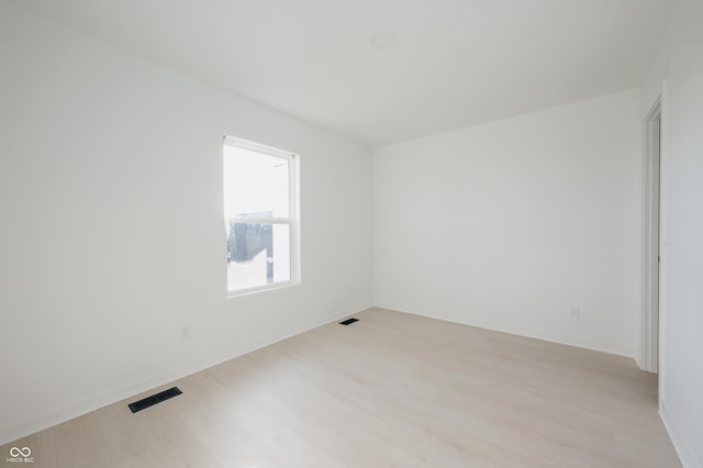 unfurnished room featuring light hardwood / wood-style flooring