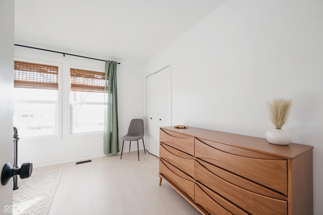 bedroom with hardwood / wood-style flooring