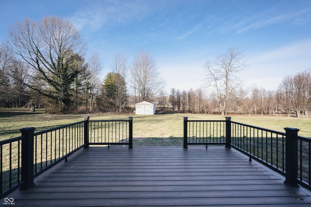 wooden deck with a shed and a yard