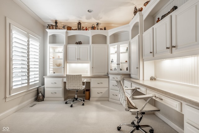 office with ornamental molding and built in desk