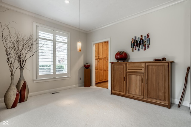 interior space with crown molding and light colored carpet