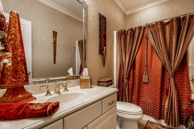 bathroom featuring vanity, crown molding, and toilet