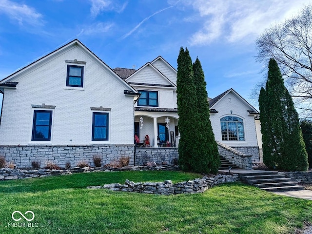 view of front of house featuring a front yard and a porch