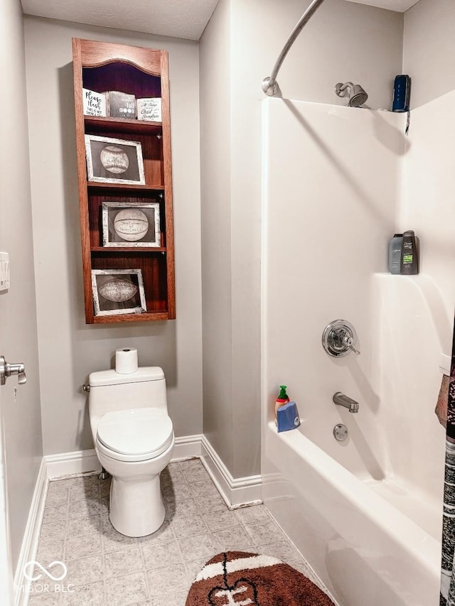 bathroom featuring toilet and bathing tub / shower combination