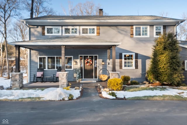 view of front of property featuring covered porch