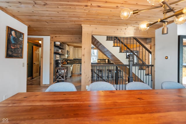 unfurnished dining area with wood ceiling