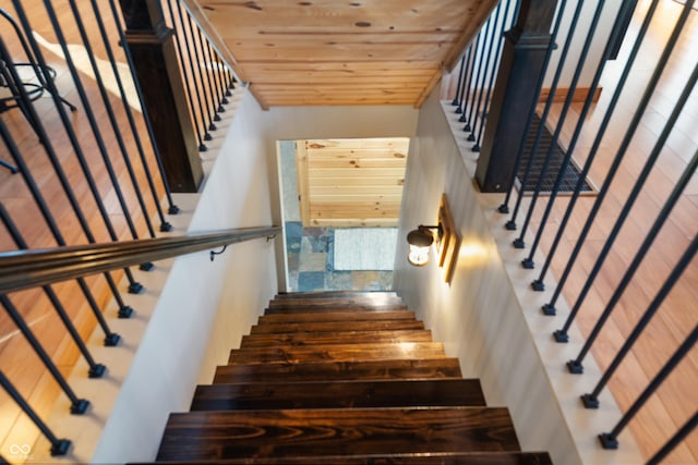 staircase featuring wooden ceiling