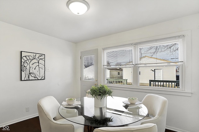 dining space with hardwood / wood-style floors