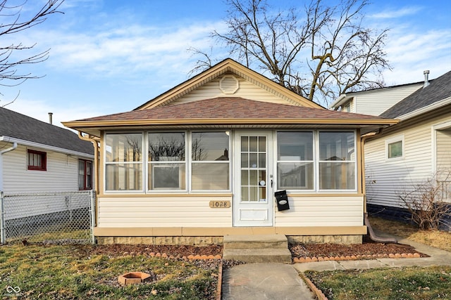 bungalow-style home with a sunroom