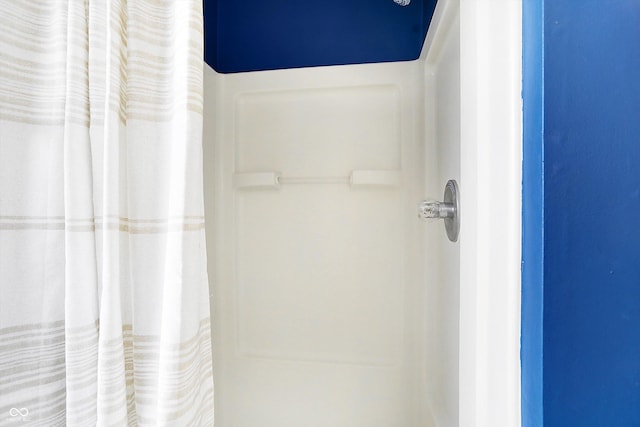 bathroom with a shower with shower curtain