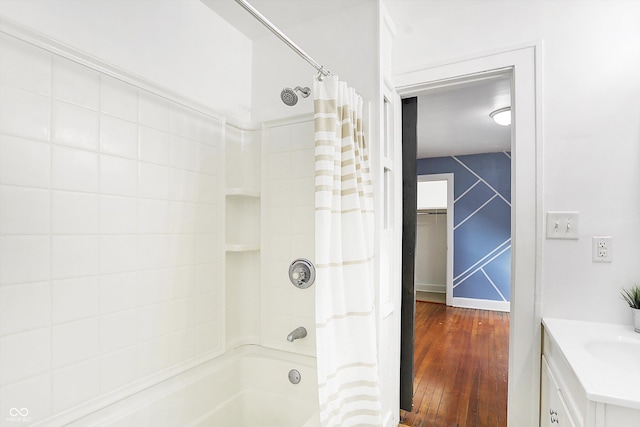 bathroom featuring vanity, hardwood / wood-style floors, and shower / bath combination with curtain