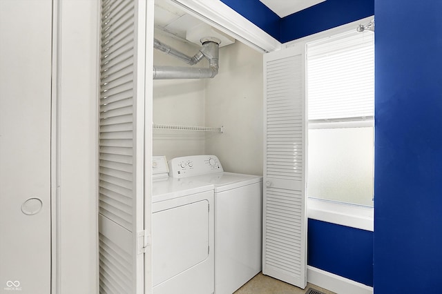 laundry room with separate washer and dryer