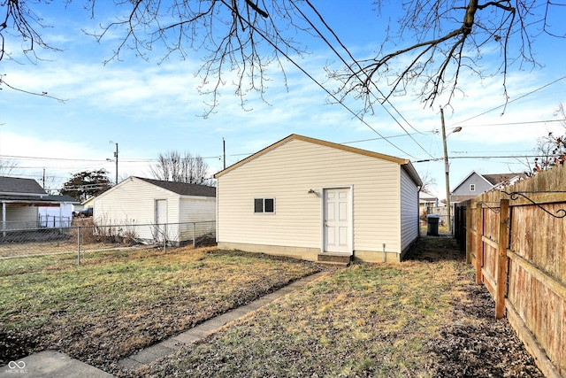 rear view of property featuring a yard